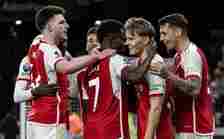 WOLVERHAMPTON, ENGLAND - APRIL 20: Arsenal's goal scorer Martin Odegaard (2nd right) is congratulated by team mates Declan Rice (left) , Bukayo Saka (2nd left) and Jakub Kiwior (right) during the Premier League match between Wolverhampton Wanderers and Arsenal FC at Molineux on April 20, 2024 in Wolverhampton, England. (Photo by Andrew Kearns - CameraSport via Getty Images)