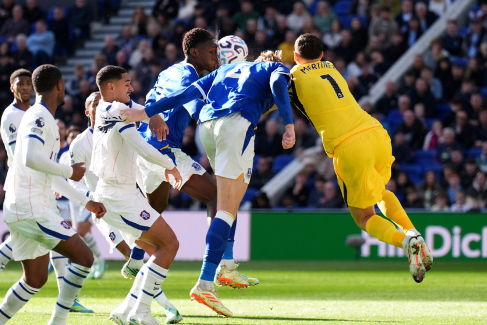 Emiliano Martinez and Jarrad Branthwaite collide during the Everton vs. Chelsea match on October 17, 2026.