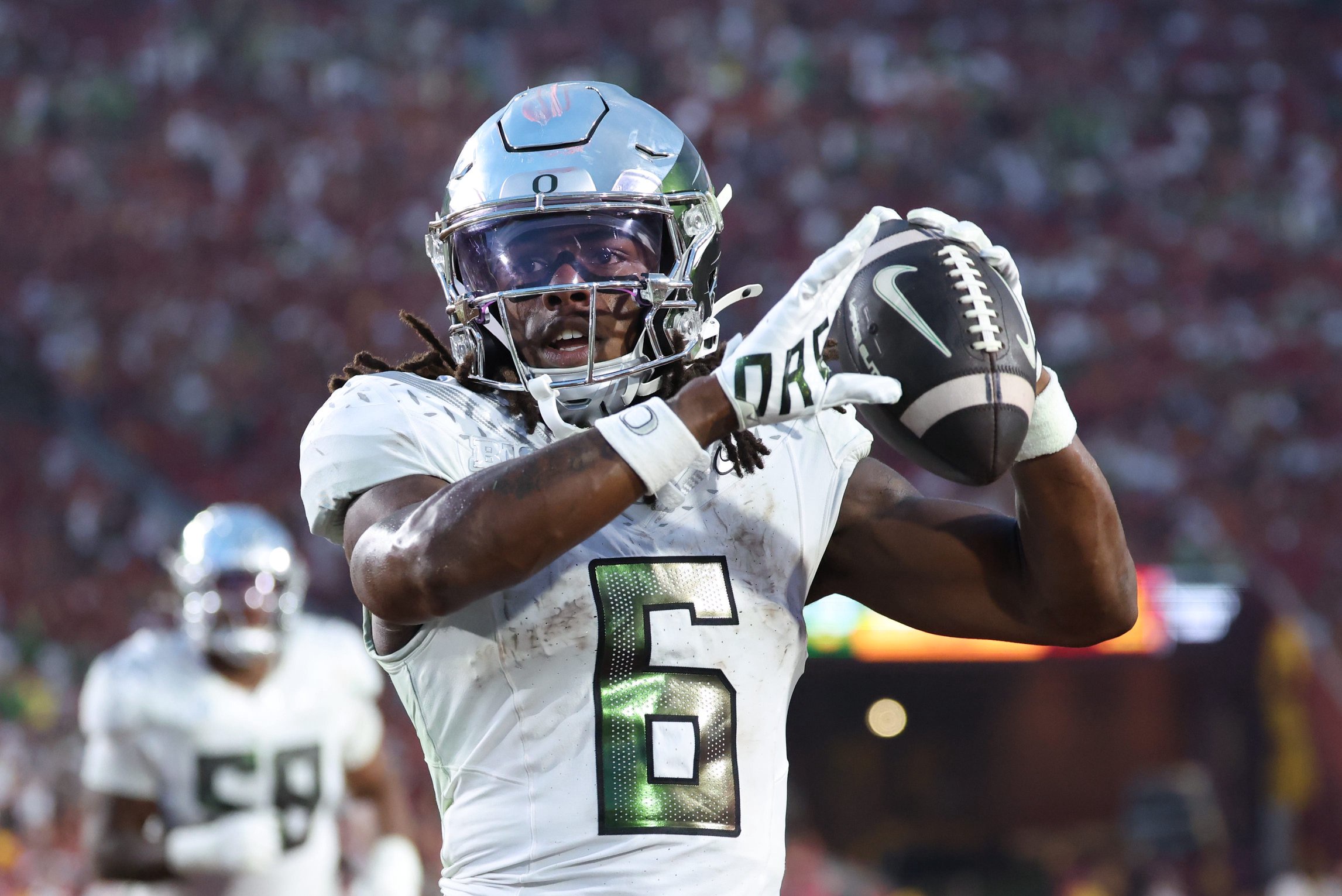 Sep 26, 2026; Los Angeles, California, USA;  Oregon Ducks running back Dierre Hill Jr. (6) reacts after running for a one-yard touchdown against the USC Trojans during the third quarter at United Airlines Field at Los Angeles Memorial Coliseum.  Mandatory Credit: Kiyoshi Mio-Imagn Images