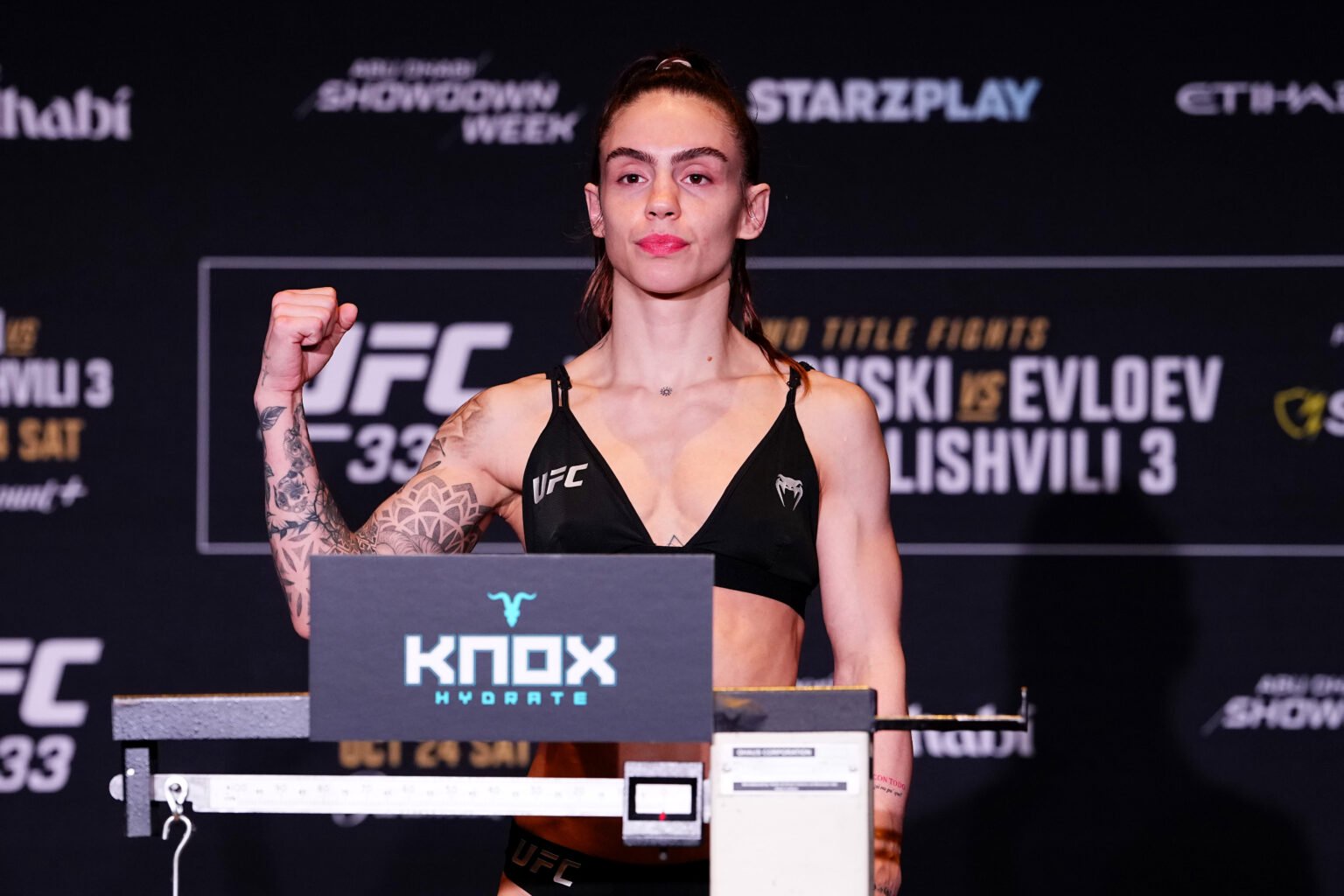 Nicolle Caliari poses on the scales at the UFC 333 weigh-ins
