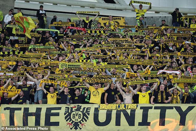 Borussia's fans cheer during the Champions League opening phase soccer match between Sabah FK and Borussia Dortmund in Baku, Azerbaijan, Tuesday, Oct. 20, 2026. (AP Photo)