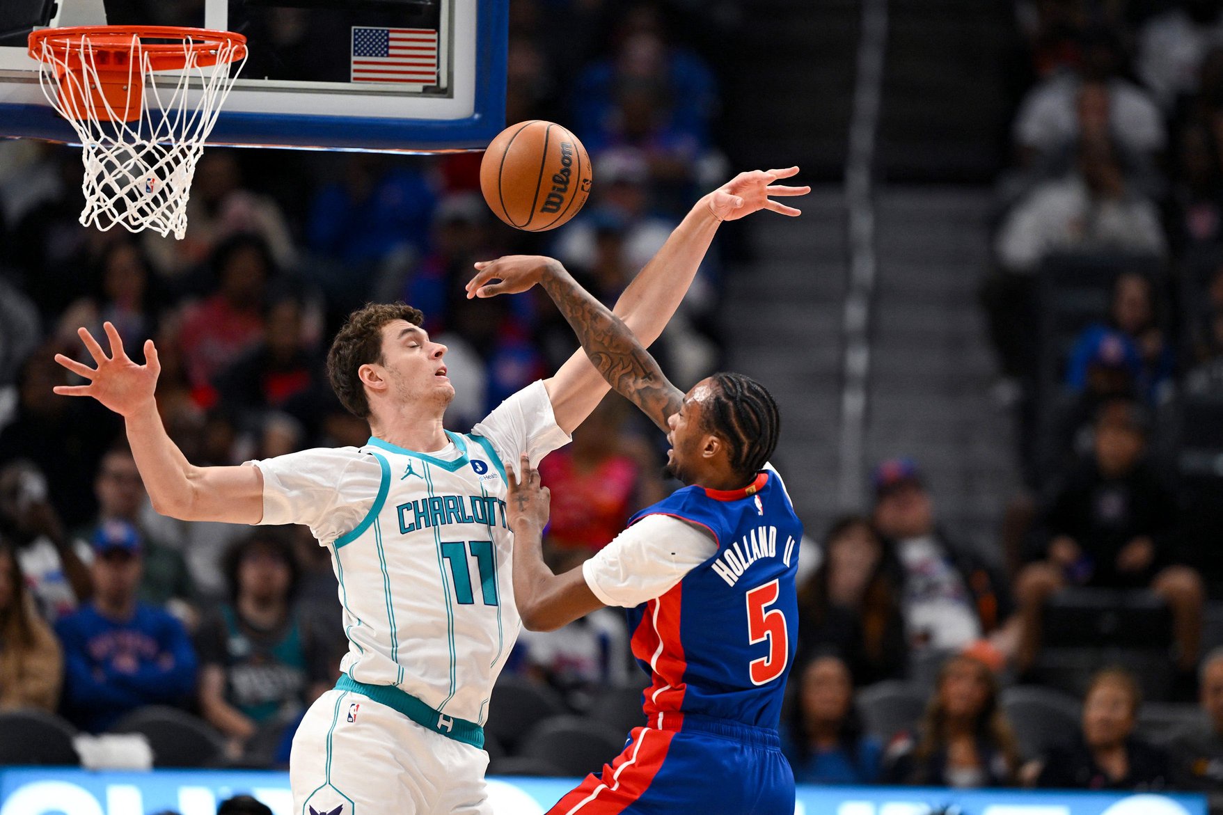 Oct 28, 2026; Detroit, Michigan, USA;  Detroit Pistons forward Ronald Holland II (5) has his shot blocked by Charlotte Hornets center Ryan Kalkbrenner (11) in the first quarter at Little Caesars Arena.  Mandatory Credit: Lon Horwedel-Imagn Images