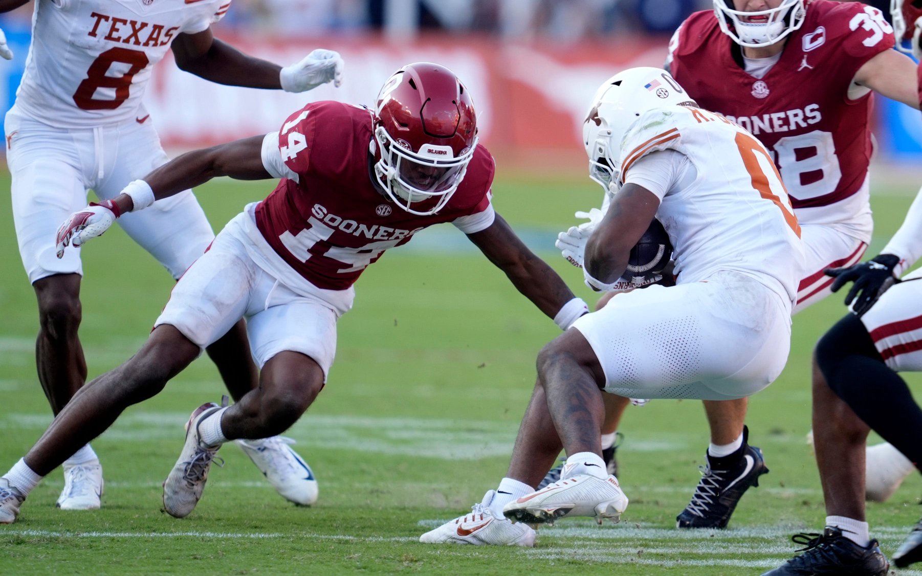 Oklahoma's Trystan Haynes (14) prepares to tackle Texas' Raleek Brown (0) in the second half of the Red River Rivalry college football game between the University of Oklahoma Sooners (OU) and the Texas Longhorn at the Cotton Bowl Stadium in Dallas, Texas,  Saturday, Oct., 10, 2026.