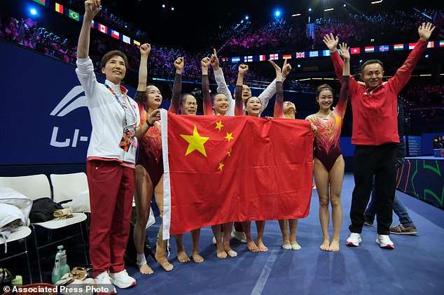 China athletes poses after winning the women's team final at the Artistic Gymnastics World Championships in Rotterdam, the Netherlands, Wednesday, Oct. 21, 2026. (AP Photo/Patrick Post)