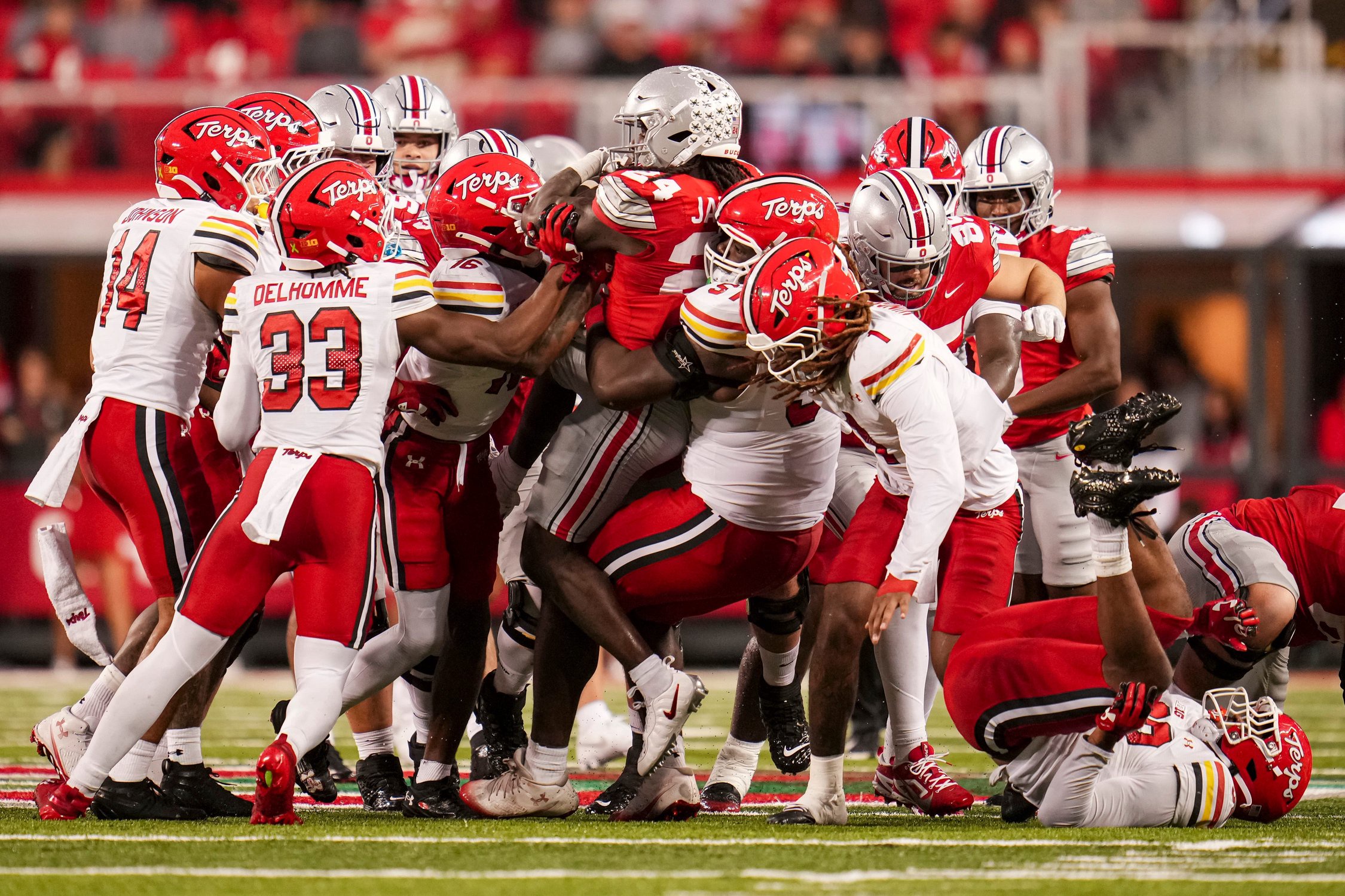 Ohio State Buckeyes running back Ja'kobi Jackson (24) fights for yardage through the Maryland Terrapins defense during the NCAA football game at Ohio Stadium in Columbus on Oct. 10, 2026.
