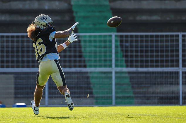 New Orleans Saints wide receiver Kyrese Rowan (86) prepares to make a catch during an NFL football practice session in Versailles near Paris, Wednesday, Oct. 21, 2026. (AP Photo/Aurelien Morissard)