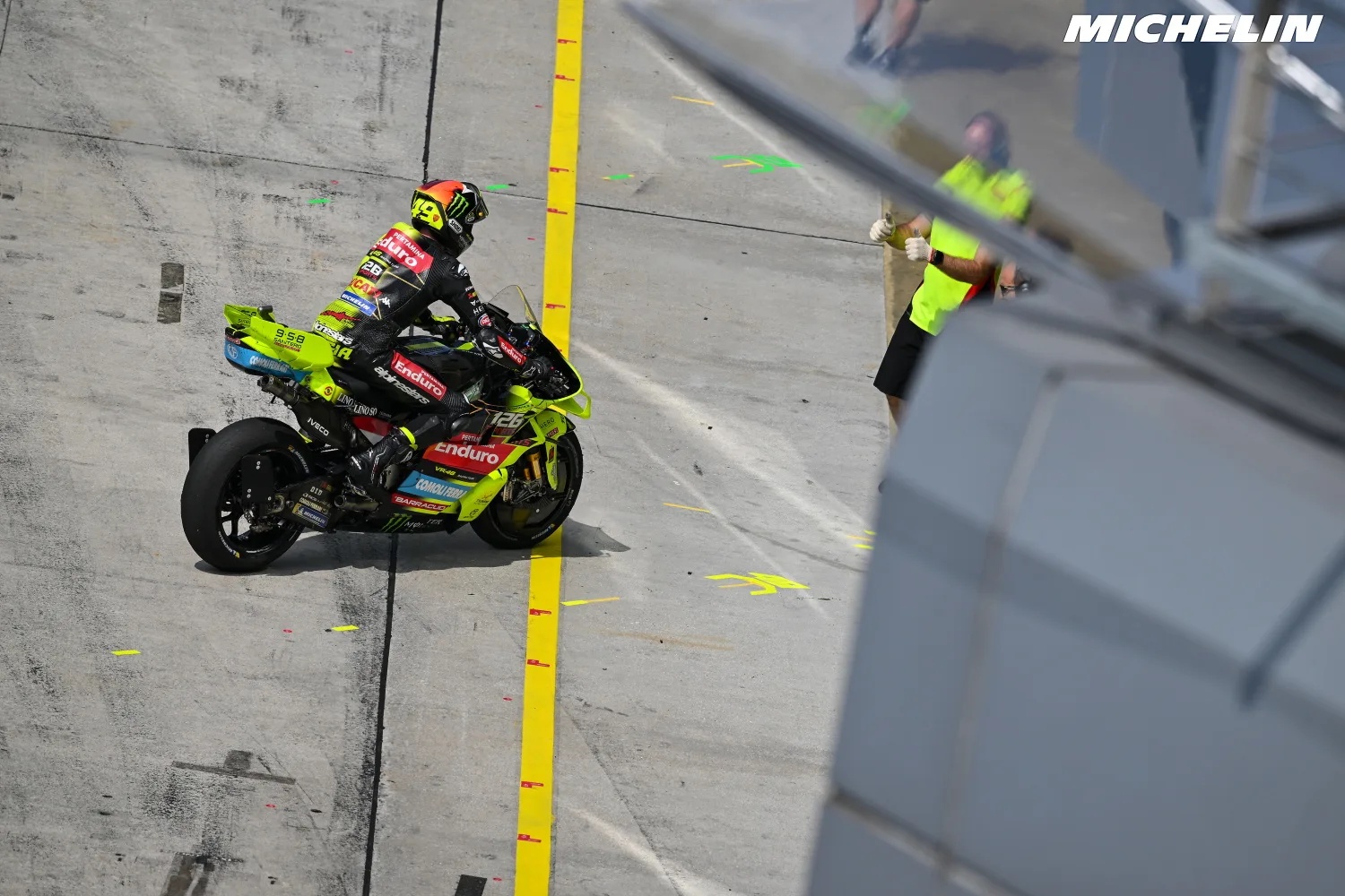 Fabio Di Giannantonio on his VR46 Ducati riding through the Sepang pit lane, MotoGP
