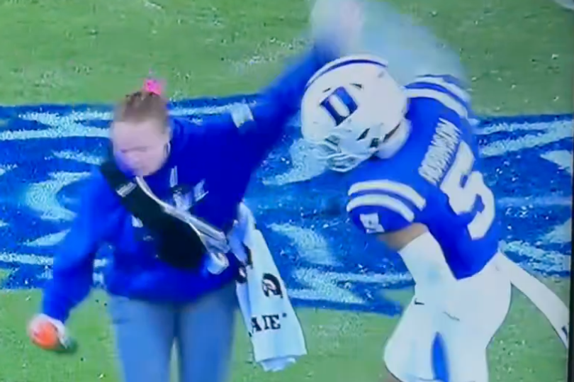 Robinson swiped her arm after she attempted to move him aside and help an injured player