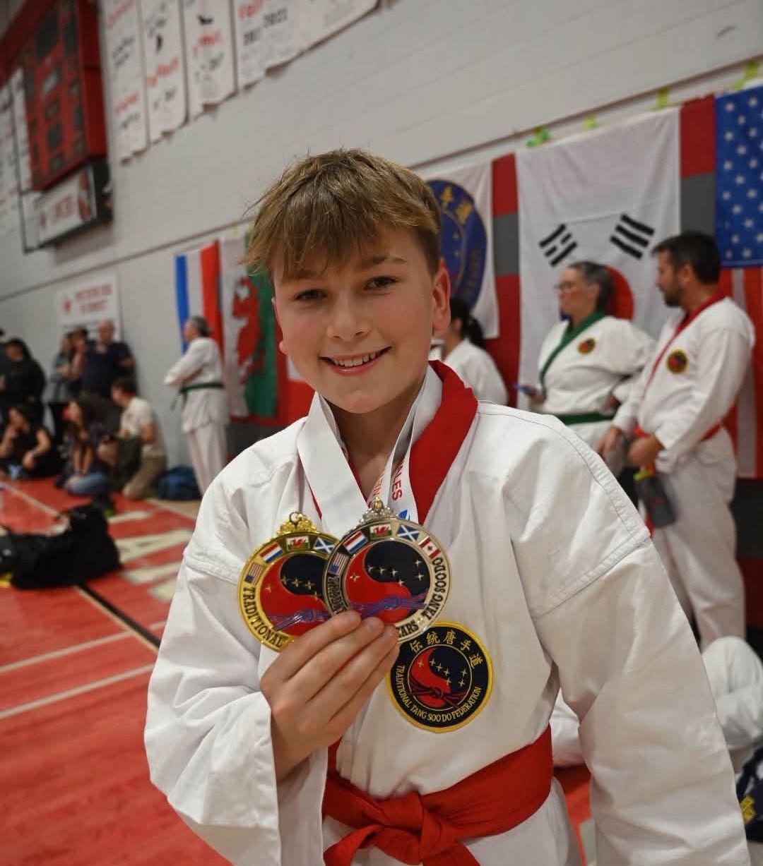 Toby Searle with his gold and silver medals.