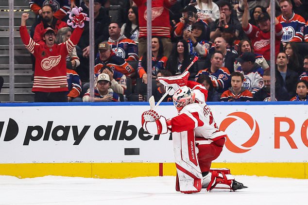 Detroit Red Wings goaltender Michal Postava (35) celebrates his team's victory against the Edmonton Oilers following NHL shootout hockey action in Edmonton, Alberta, Monday, Oct. 26, 2026. (Codie McLachlan/The Canadian Press via AP)