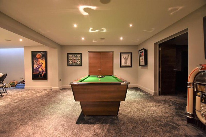 A personalised pool table has "PP" on it courtesy of previous owner Pogba