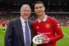 Former Manager Sir Alex Ferguson congratulates Cristiano Ronaldo of Manchester United on scoring his 700th club career goals ahead of the Premier L...