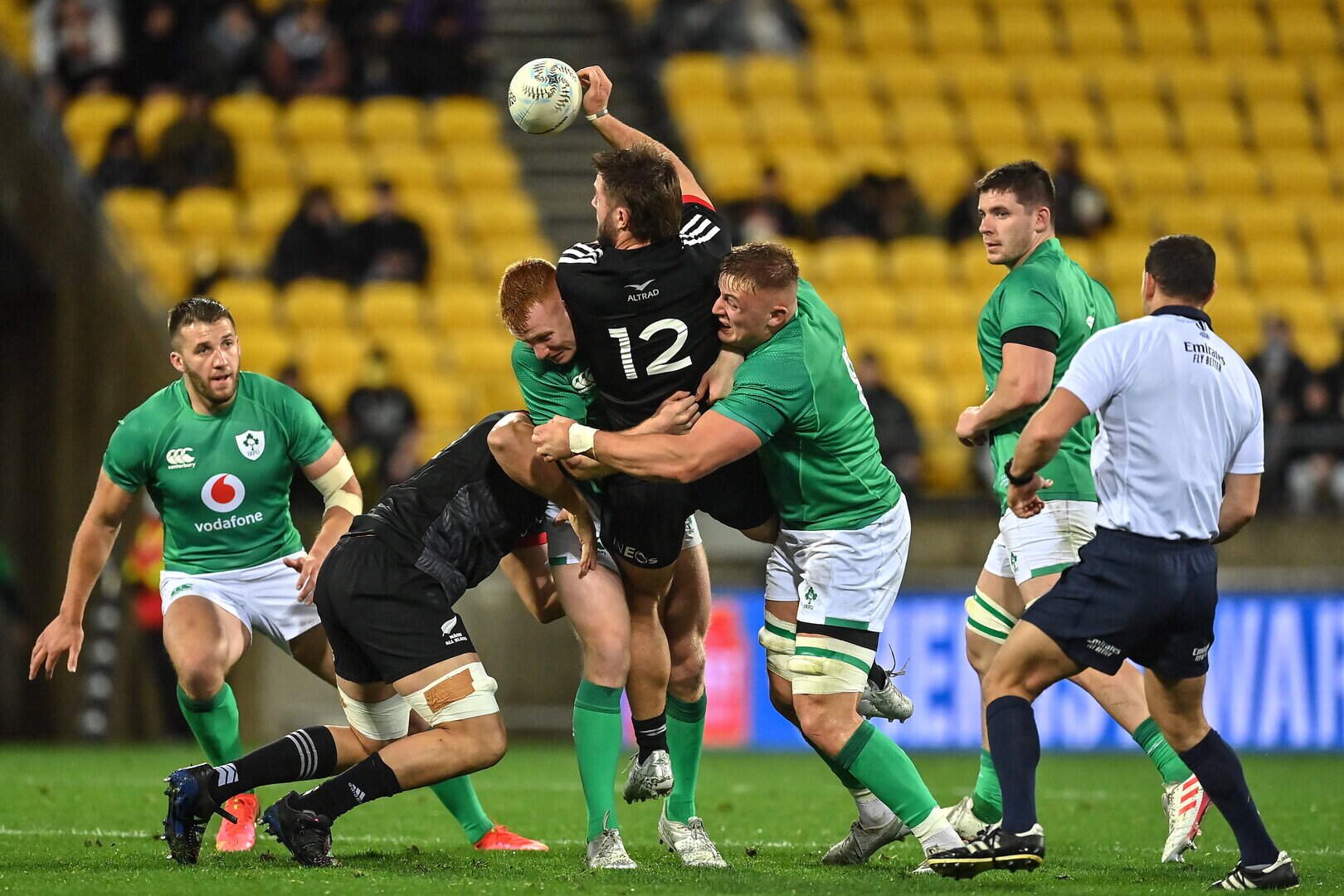 Alex Nankivell of Maori All Blacks is tackled by Ciarán Frawley, left, and Gavin Coombes of Ireland at the Sky Stadium in Wellington, New Zealand