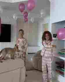 Tammy's children, Wolf, eight, (left) Saskia, six, (right) and Posy, one, joined forces to surprise their doting mother by setting up the decorations