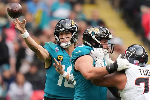 Jacksonville Jaguars quarterback Trevor Lawrence (16) passes the ball during an NFL football game against Houston Texans in London, Sunday, Oct. 18, 2026. (AP Photo/Kin Cheung)