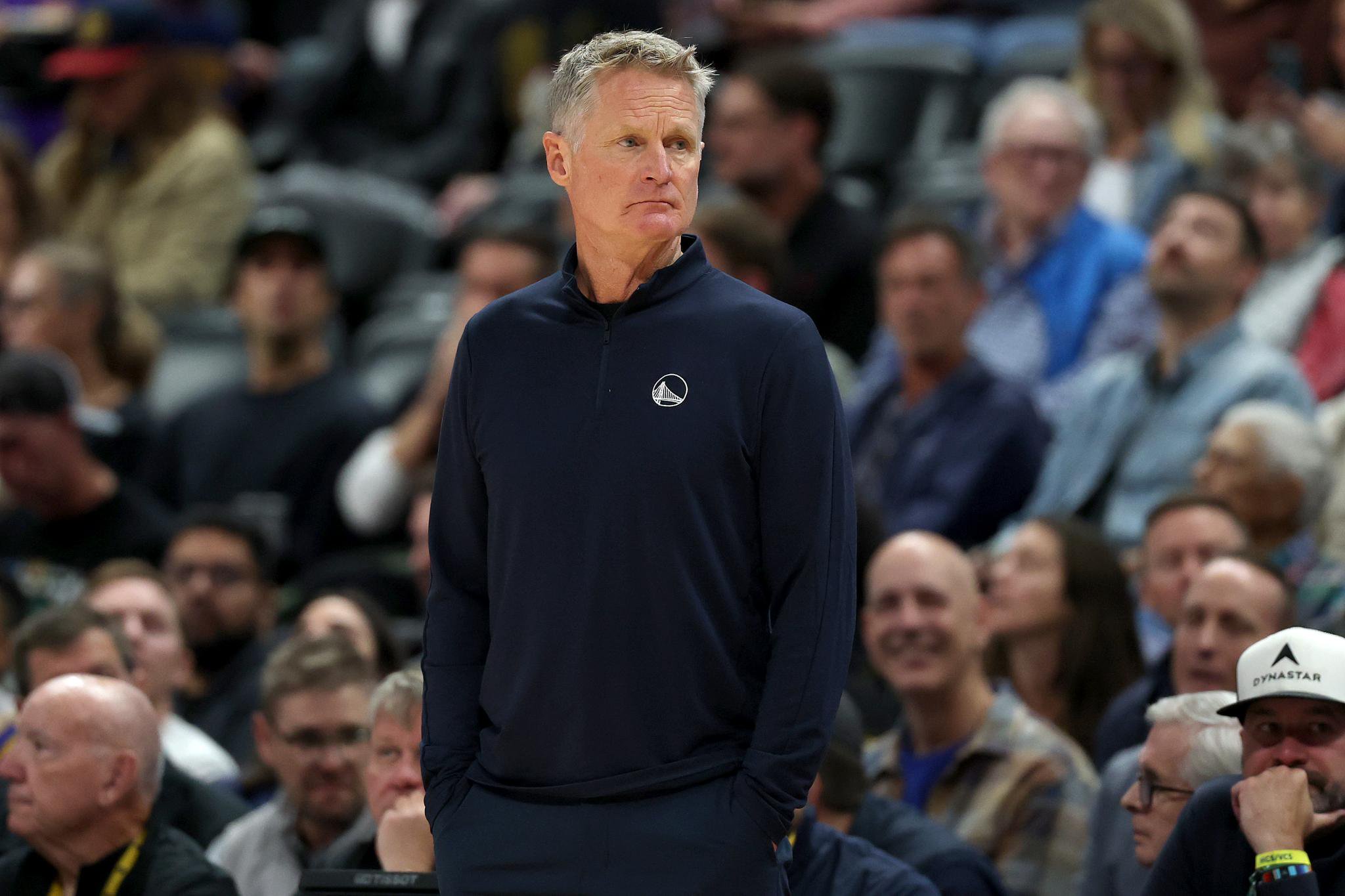 Golden State Warriors head coach Steve Kerr watches his team play the Denver Nuggets at Ball Arena.