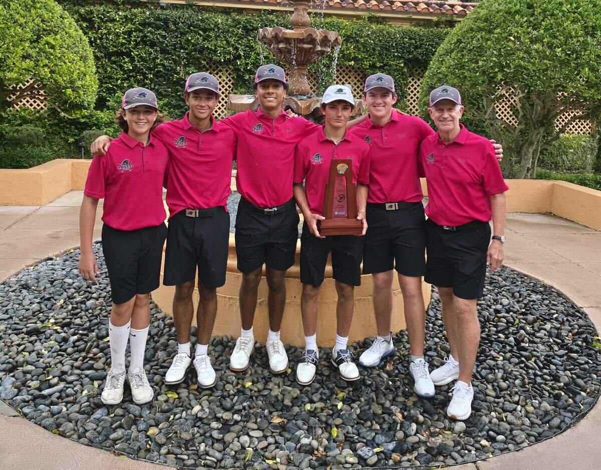 The district champion Ransom Everglades boys’ golf team, coached by David Ragan