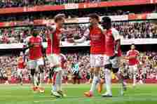LONDON, ENGLAND - MAY 04: Bukayo Saka of Arsenal celebrates scoring his team's first goal from a penalty kick with teammates Kai Havertz and Martin Odegaard during the Premier League match between Arsenal FC and AFC Bournemouth at Emirates Stadium on May 04, 2024 in London, England. (Photo by Stuart MacFarlane/Arsenal FC via Getty Images)