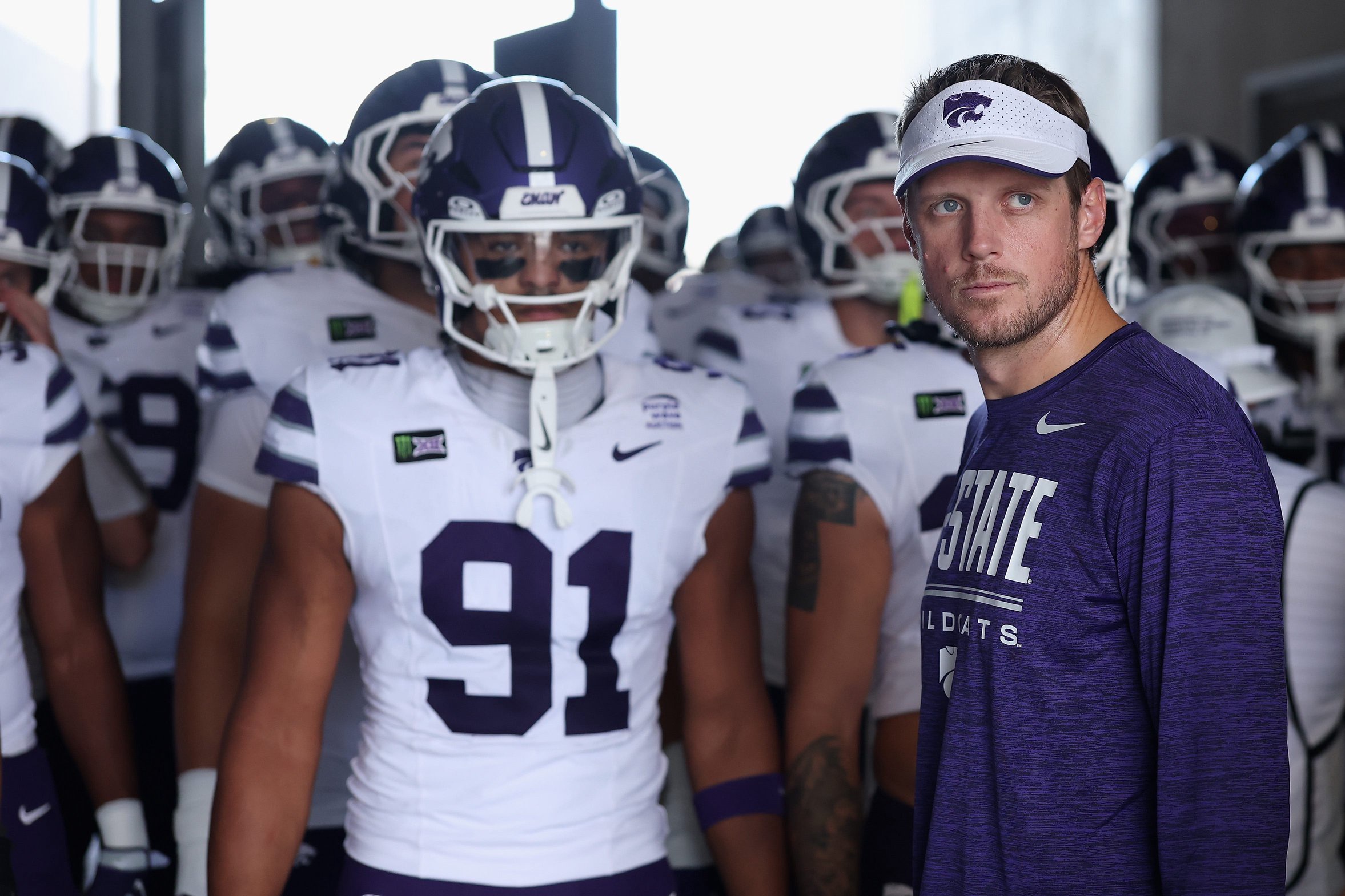 TEMPE, ARIZONA - OCTOBER 24: Head coach Collin Klein of the Kansas State Wildcats stands in the tunnel with teammates before the game against the Arizona State Sun Devils at Sun Devil Stadium on October 24, 2026 in Tempe, Arizona.  (Photo by Christian Petersen/Getty Images)