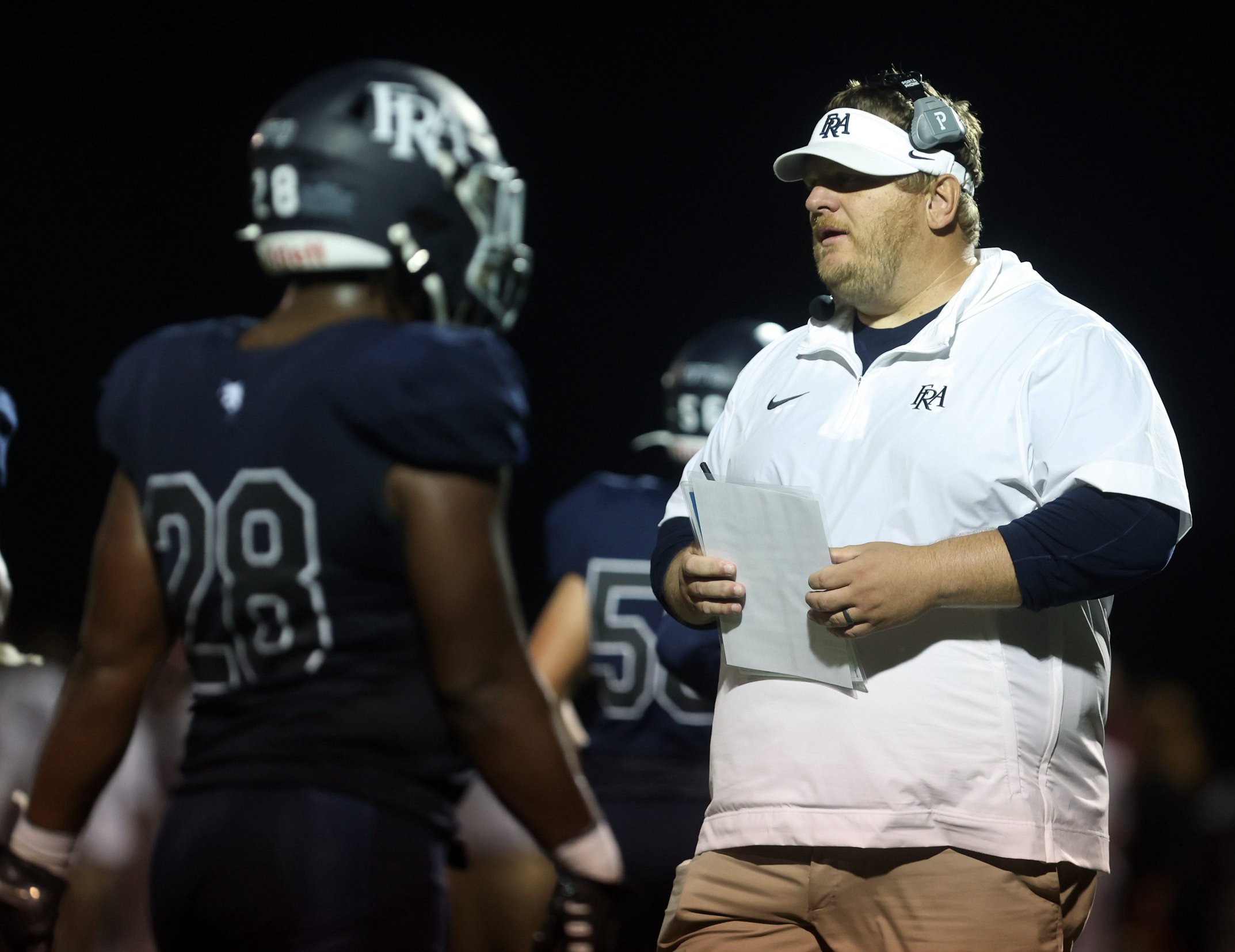Head coach Justin Geisinger of Franklin Road Academy talks to his team during their game against Davidson Academy at Franklin Road Academy Friday, September 29, 2023.