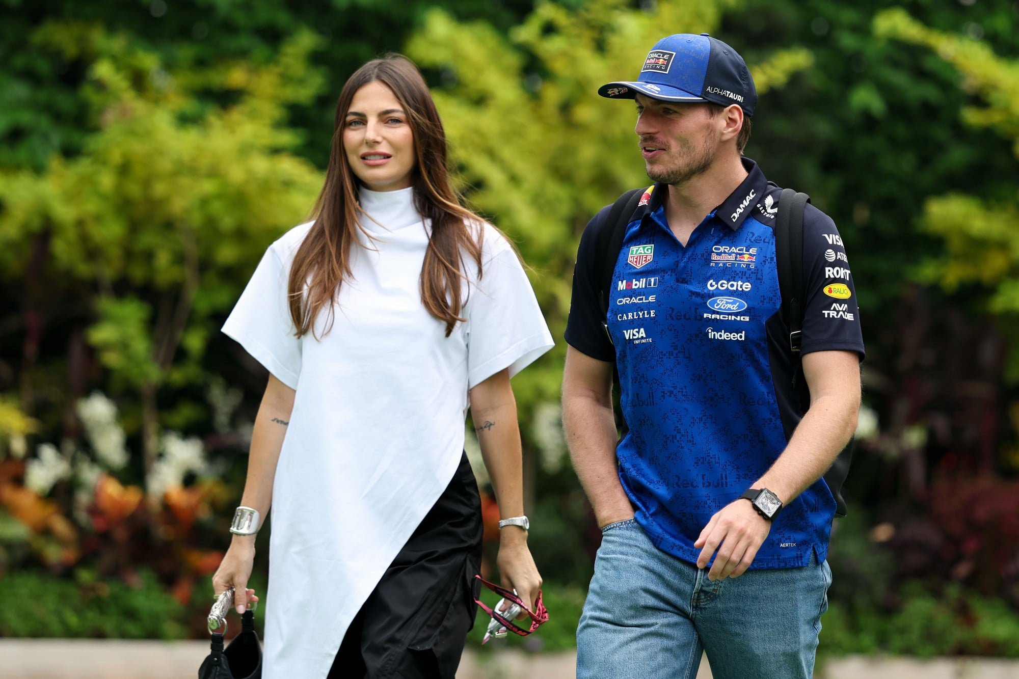 Max Verstappen and Kelly Piquet arrive in the Paddock during the F1 Grand Prix of Singapore