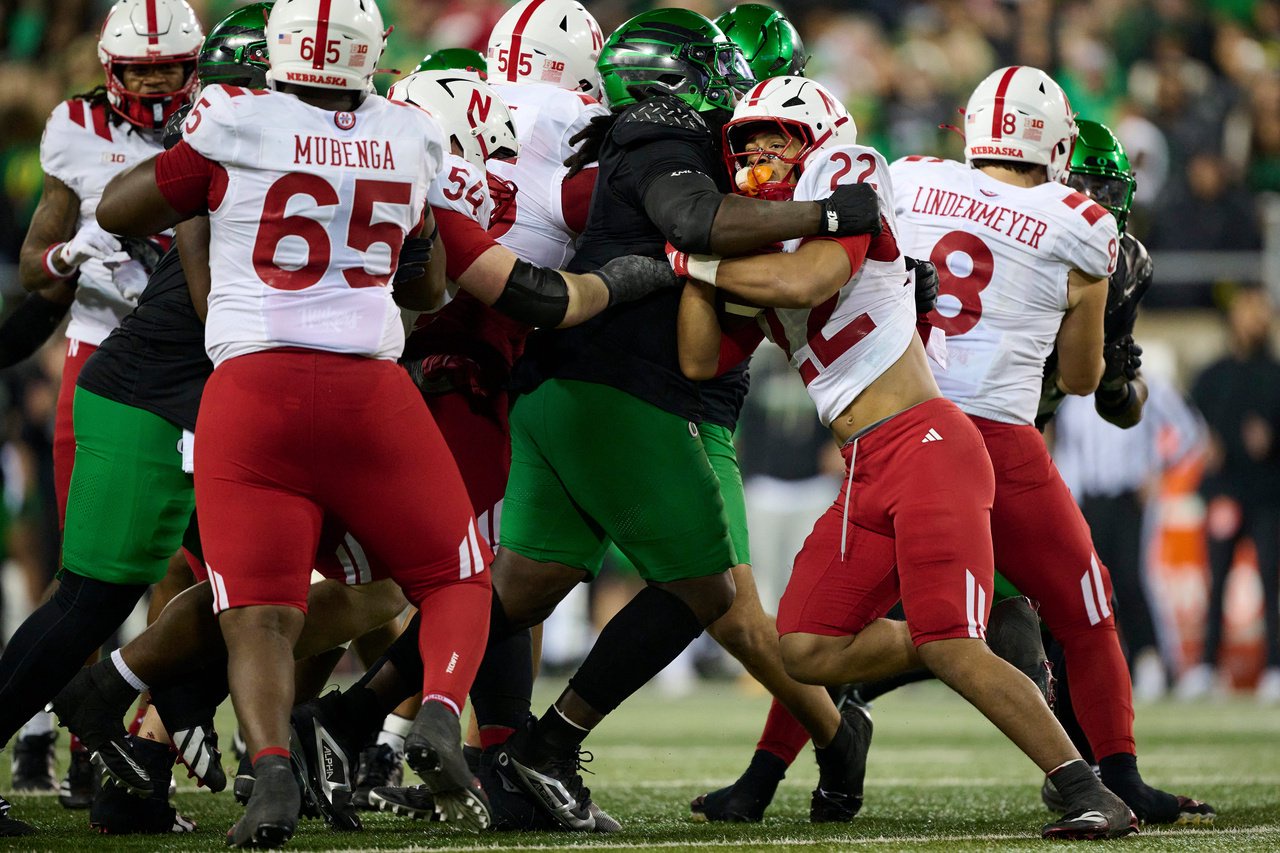 Oct 17, 2026; Eugene, Oregon, USA; Nebraska Cornhuskers running back Isaiah Mozee (22) is tackled during the second half by Oregon Ducks defensive lineman Bear Alexander (1) at Autzen Stadium. Mandatory Credit: Troy Wayrynen-Imagn Images