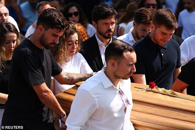 Rute Cardoso helps as pallbearers carry a coffin, at the funeral ceremony of her late husband Liverpool's Portuguese soccer player Diogo Jota and his brother Andre Silva