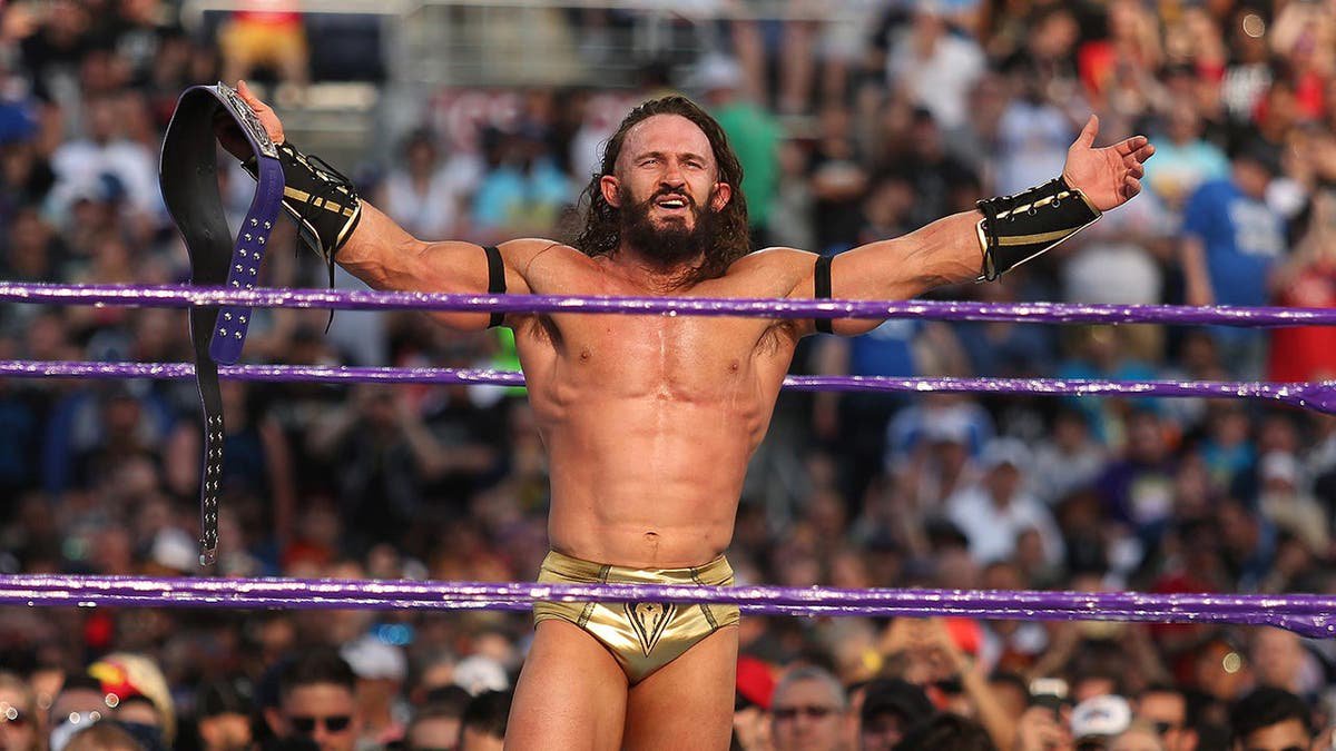 Adrian Neville celebrates his victory at Camping World Stadium in Orlando, Fla.