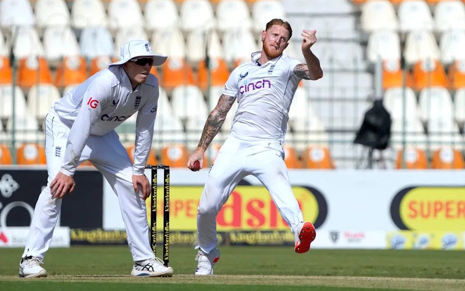 England's Ben Stokes, right, bowls as Zak Crawley fields during the first day of the second test cricket match between Pakistan and England, in Multan, Pakistan, Tuesday, Oct. 15, 2024
