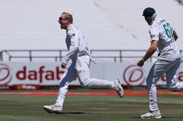 South Africa's Simon Harmer celebrates with teammates the wicket of Australia's Marnus Labuschagne, on day two of the third cricket test match between South Africa and Australia, in Cape Town, South Africa, Wednesday, Oct. 28, 2026. (AP Photo/Halden Krog)