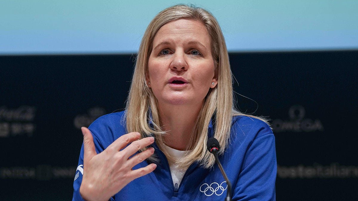 Kirsty Coventry talks to reporters