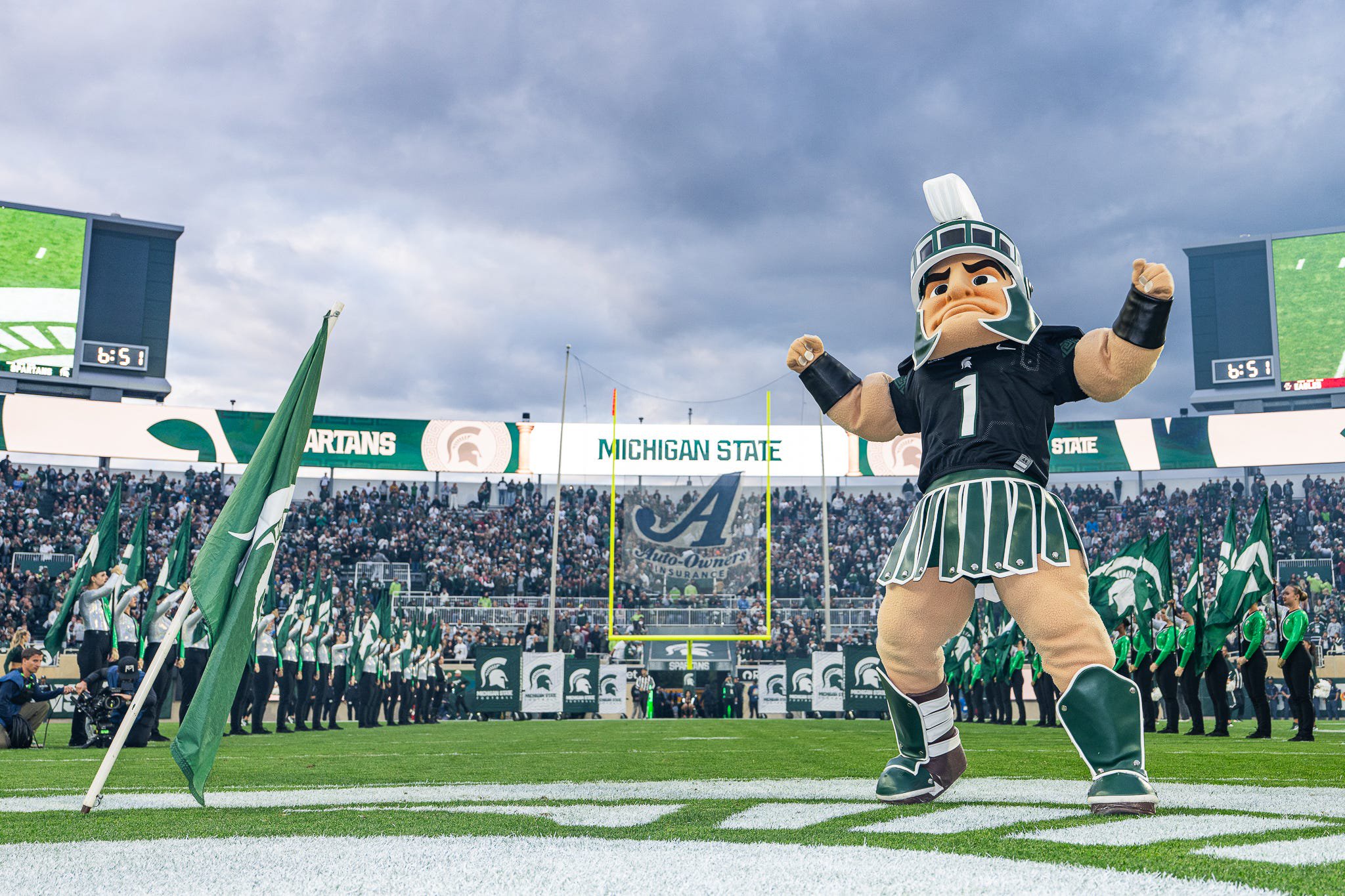 Michigan State’s Sparty plants an MSU flag in the field prior to a game against Boston College at Spartan Stadium in East Lansing on Saturday, September 6, 2025.