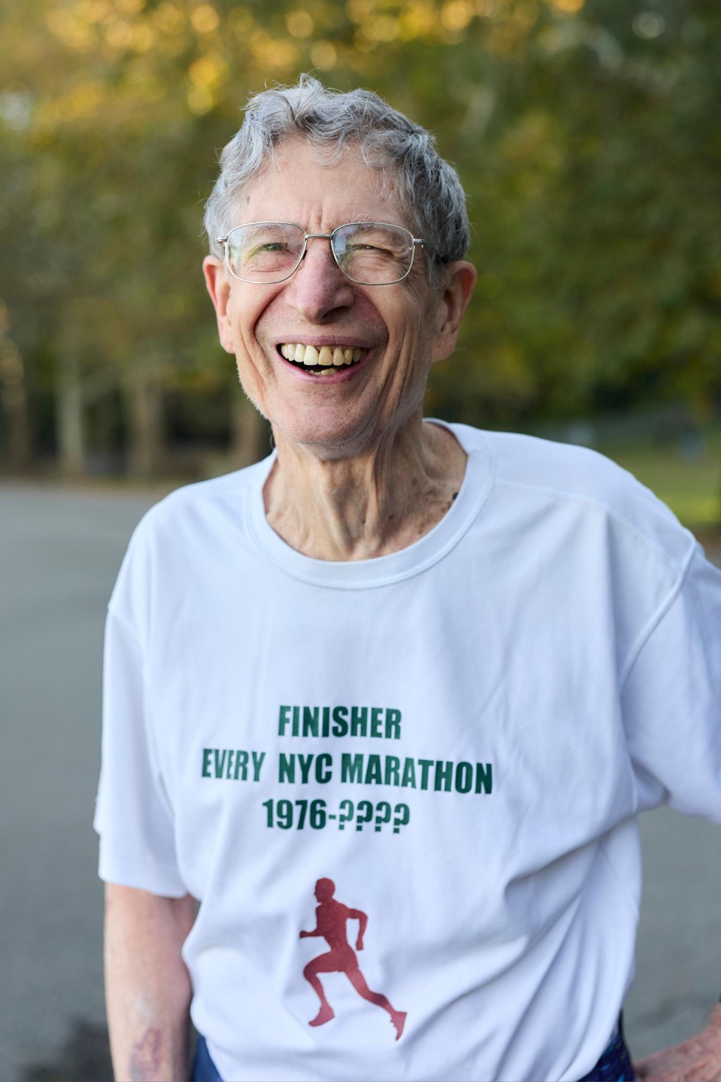 Dave Obelkevich wearing a custom finisher shirt for the New York City Marathon.