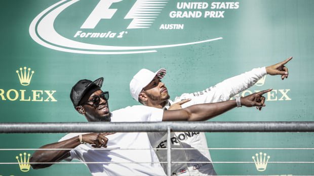 Lewis Hamilton celebrates winning the 2017 US Grand Prix with Usain Bolt