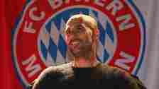 Josep "Pep" Guardiola, head coach of German Football Bundesliga Club FC Bayern Munich in front of the club logo