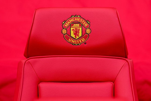 MANCHESTER, ENGLAND - OCTOBER 25: Detail of a Manchester United emblem seen on a seat in the dugout during the Premier League 2026/27 match between Manchester United and AFC Bournemouth at Old Trafford on October 25, 2026 in Manchester, United Kingdom. (Photo by Robbie Jay Barratt - AMA/Getty Images)
