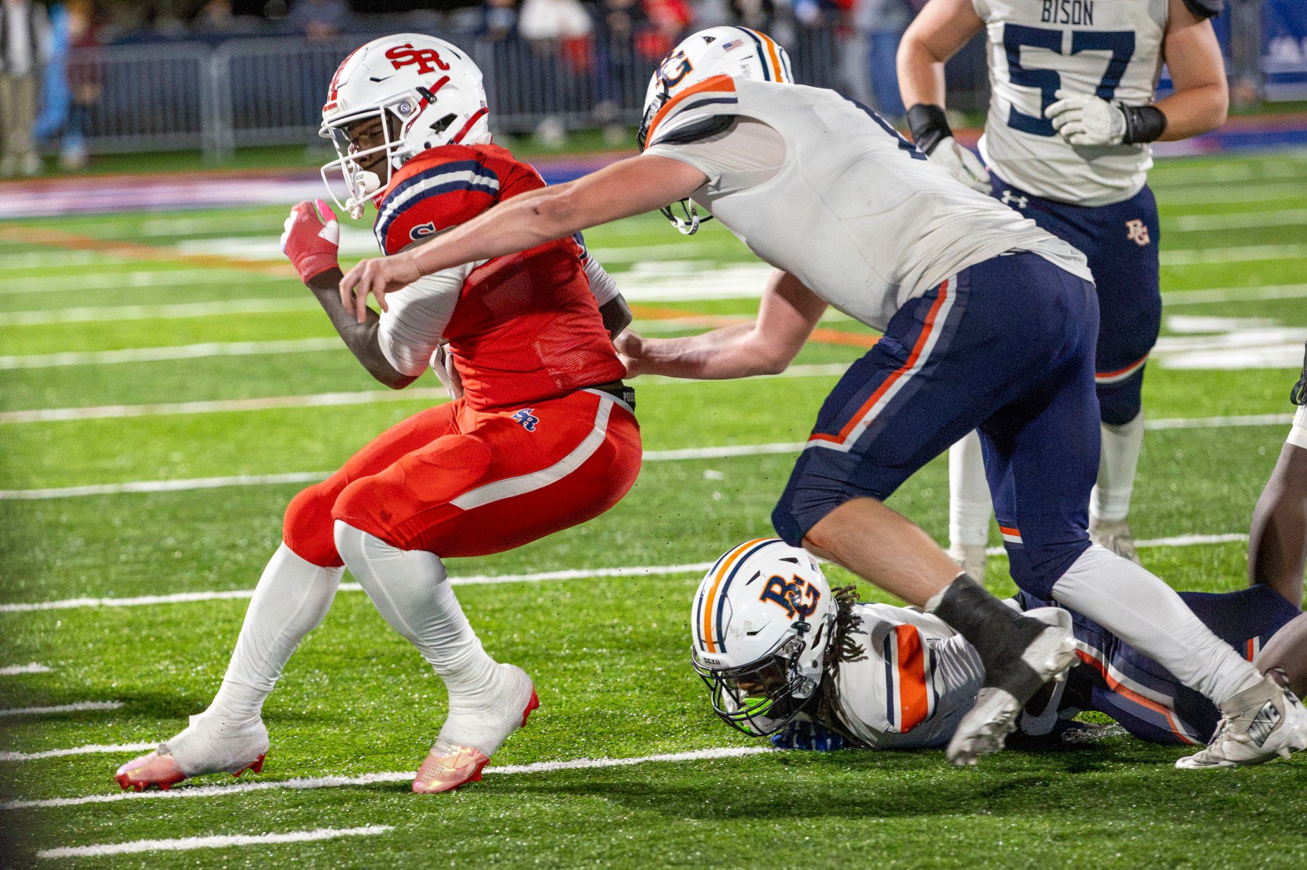 St. Rita's Brandon Johnson Jr. (4) is tackled by Buffalo...