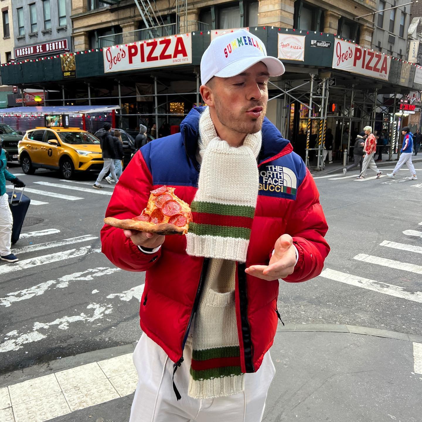 Man City star Jack Grealish shares snaps of himself eating pizza on street of New York as he holidays with girlfriend, Sasha Attwood (Photos)