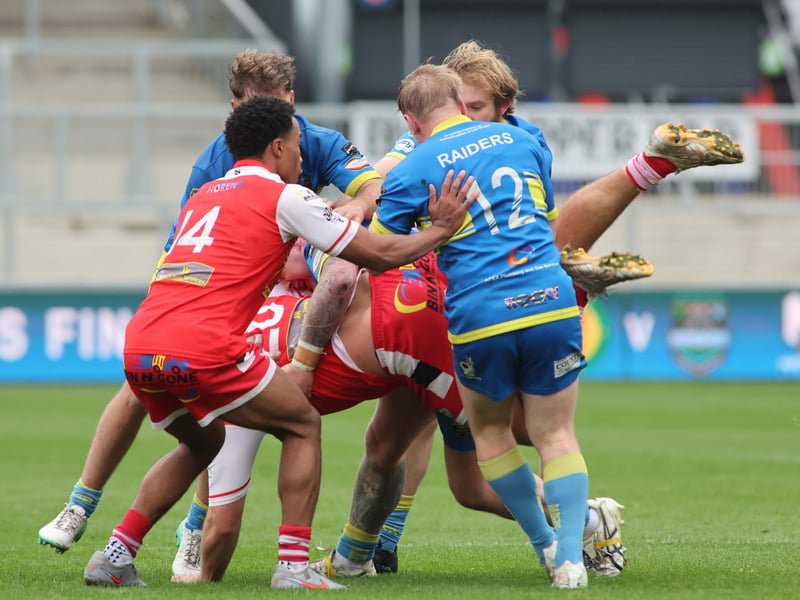 There was no holding back by either team in the National League Division One play-off final between East Leeds (in red) and Oulton Raiders.