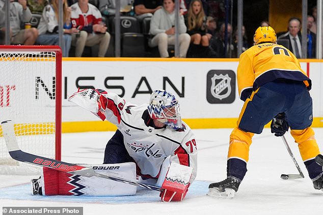 Nashville Predators left wing Filip Forsberg (9) scores a goal past Washington Capitals goaltender Charlie Lindgren (79) during the second period of an NHL hockey game Thursday, Oct. 29, 2026, in Nashville, Tenn. (AP Photo/George Walker IV)