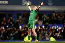 Jordan Pickford looks to the heavens and throws his arms into the air in celebration