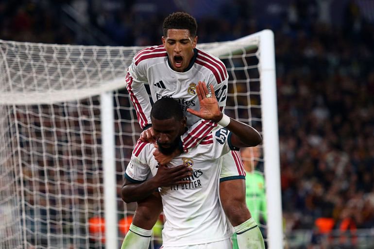 Antonio Rudiger of Real Madrid celebrates scoring his team’s fourth goal with Jude Bellingham during the UEFA Champions League 2026/27 League Phase MD2 match between AS Roma and Real Madrid
