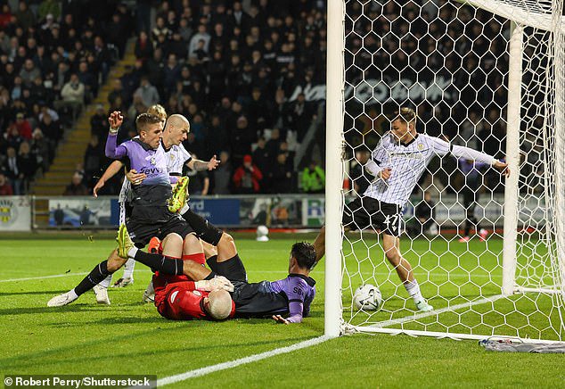 Ivezic stabs the ball in from close range to give Hibs the lead in Paisley