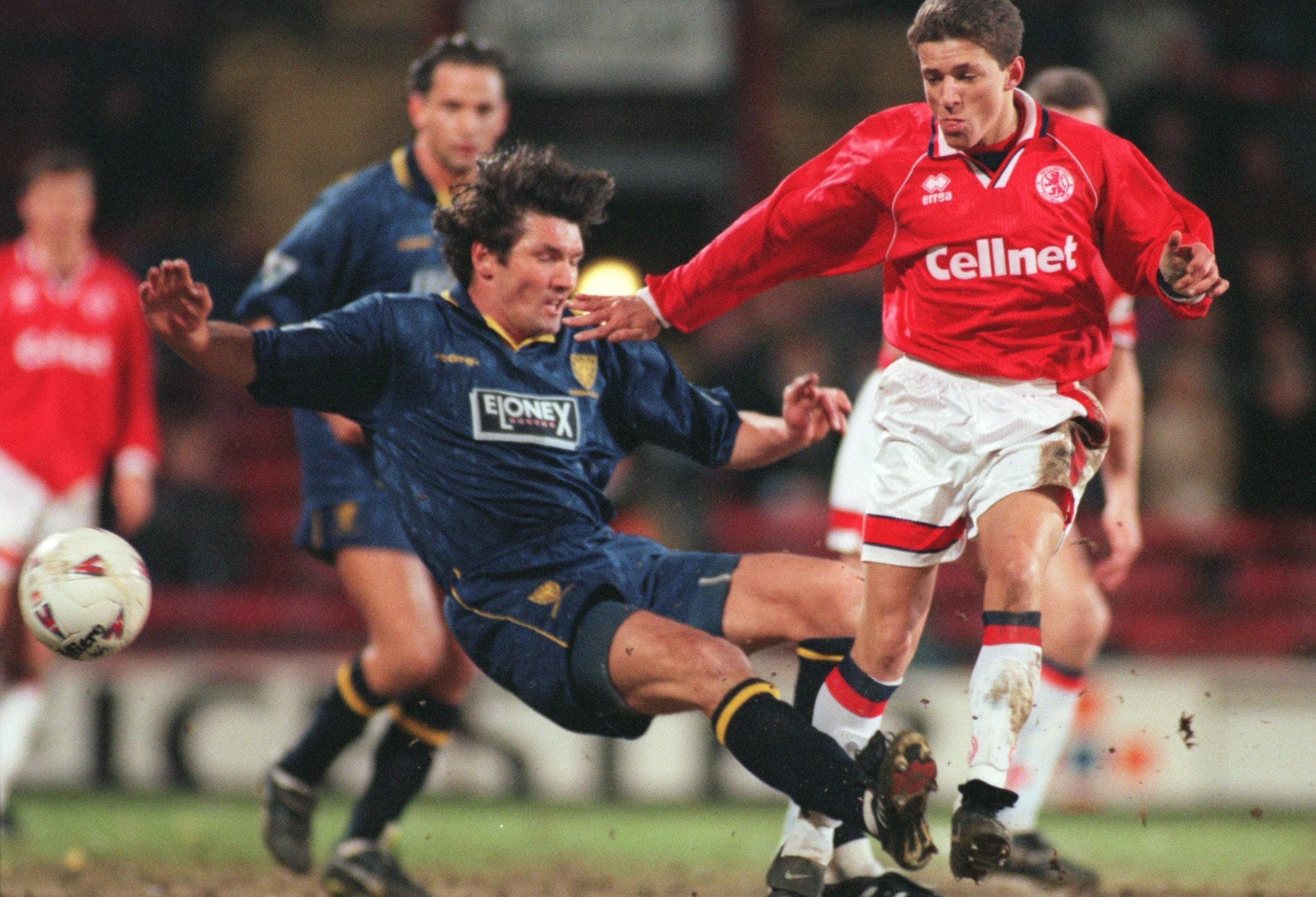 Juninho of Middlesbrough is tackled by Mick Harford of Wimbledon