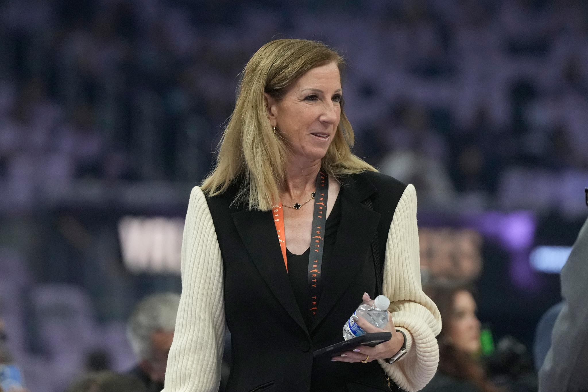 WNBA commissioner Cathy Engelbert walking on the court.