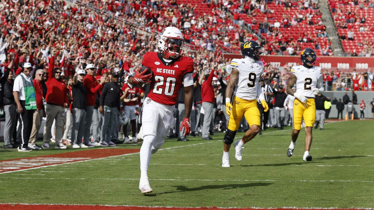 N.C. State’s  Deandre Desinor (20) scores on a 49-yard touchdown reception in the first half of N.C. State’s game against California at Cater-Finley Stadium in Raleigh, N.C., Saturday, Oct. 31, 2026.