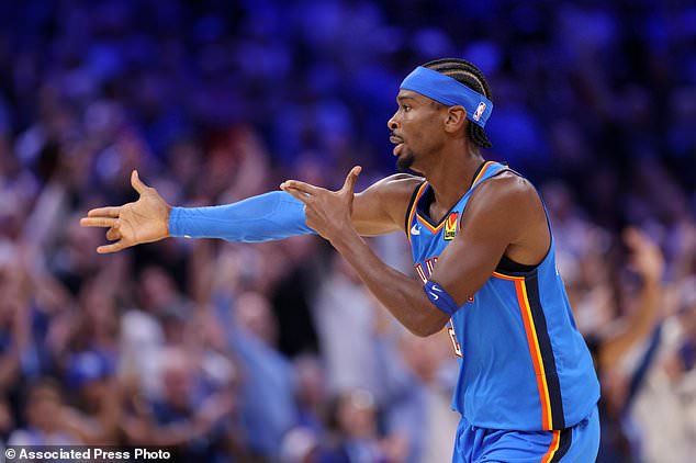 Oklahoma City Thunder guard Shai Gilgeous-Alexander celebrates after making a basket during the second half of an NBA basketball game against the Denver Nuggets, Thursday, Oct. 22, 2026, in Oklahoma City. (AP Photo/Nate Billings)