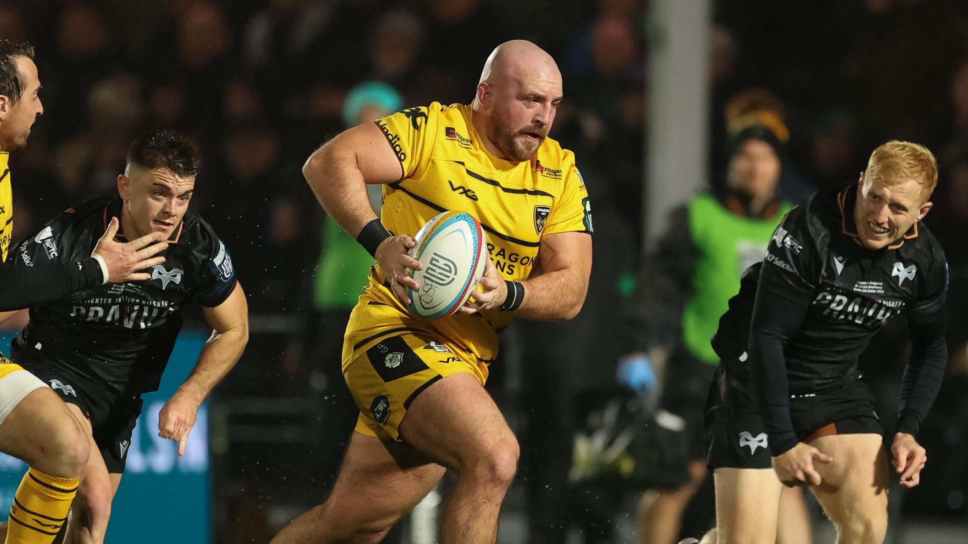 Dillon Lewis carries the ball for Dragons at Ospreys