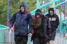 'The third week of June should initially continue to be wetter than normal across much of the UK,' BBC Weather explained. Pictured: visitors to a very wet Thorpe Park on June 10