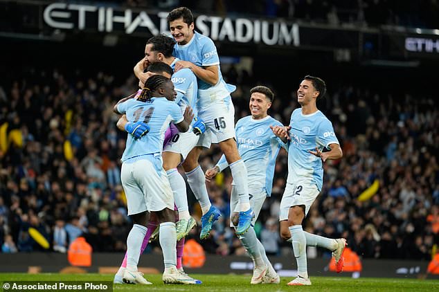 Manchester City players celebrate at the end of the English League Cup soccer match between Manchester City and Brighton and Hove Albion in Manchester, England, Wednesday, Oct. 28, 2026. (AP Photo/Dave Thompson)